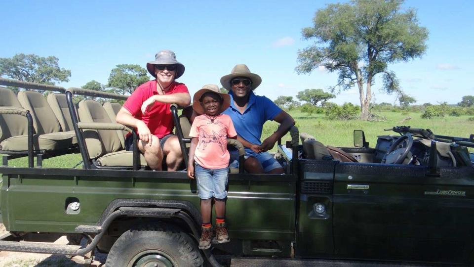 <p>Courtesy of African Travel, Inc</p> Banda with his family in South Africa’s Sabi Sabi Reserve.