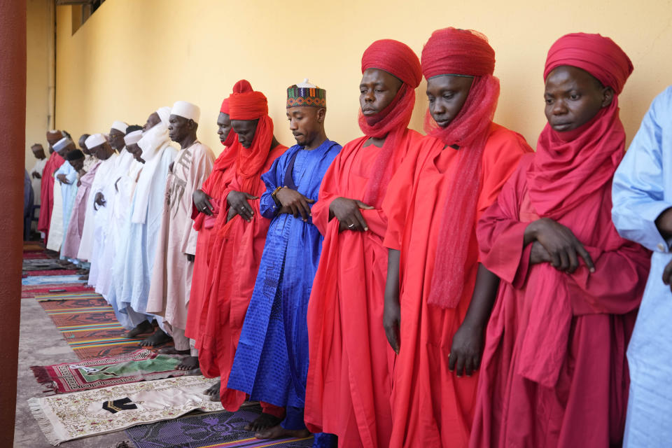 Muslim faithful pray during a traditional Friday prayers at the Moddibo Adama Mosque in Yola Nigeria, Friday, Feb. 24, 2023. On Feb. 25, voters will choose among 18 candidates in a first-round vote to succeed incumbent President Muhammadu Buhari, but despite being Africa's largest economy and and one of its top oil producers, Nigeria is in economic crisis. (AP Photo/Sunday Alamba)