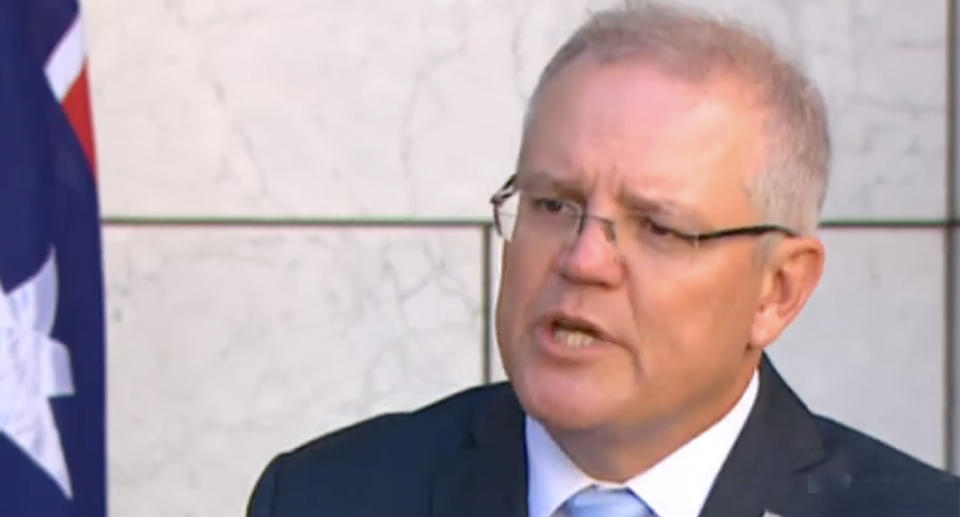 Prime Minister Scott Morrison rejects a reporter's criticism while addressing media at parliament house. 