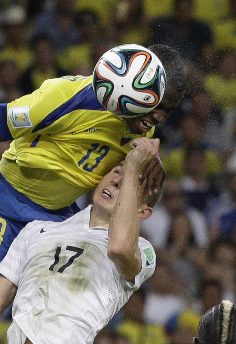 Ecuador's Enner Valencia, left, and France's Lucas Digne go for a header during the group E World Cup soccer match between Ecuador and France at the Maracana Stadium in Rio de Janeiro, Brazil, Wednesday, June 25, 2014. (AP Photo/Christophe Ena)