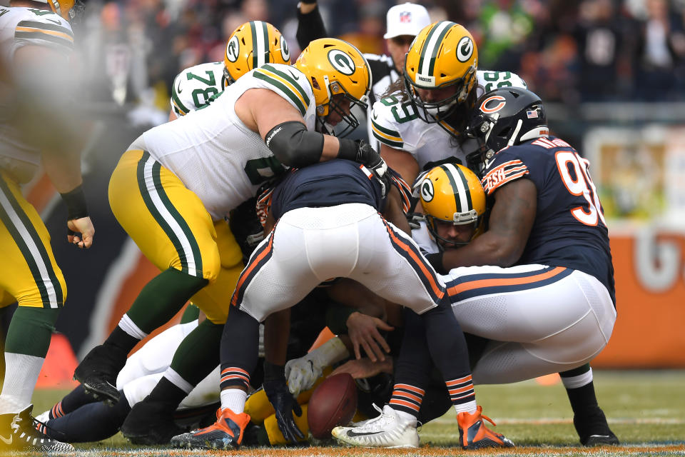 <p>Green Bay Packers quarterback Aaron Rodgers (12) is tackled by Chicago Bears defensive tackle Bilal Nichols (98) in action during an NFL game between the Green Bay Packers and the Chicago Bears on December 16, 2018 at Soldier Field in Chicago, IL. (Photo by Robin Alam/Icon Sportswire) </p>