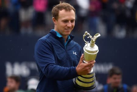 FILE PHOTO - Golf - The 146th Open Championship - Royal Birkdale - Southport, Britain - July 23, 2017 USAÕs Jordan Spieth celebrates with The Claret Jug after winning The Open Championship REUTERS/Hannah McKay