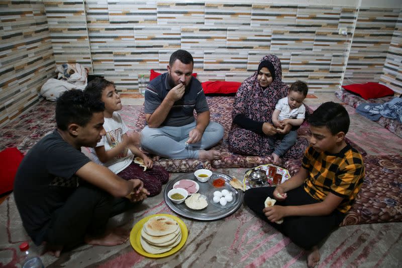 Sleepless Gazans keep children, and essential documents close to hand in Khan Younis