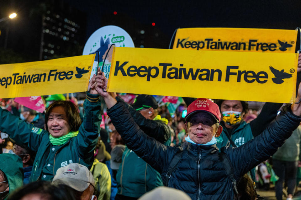 DPP supporters cheer and hold up banners during a campaign rally in Taipei City on Jan. 11, 2024.<span class="copyright">Annabelle Chih—Getty Images</span>