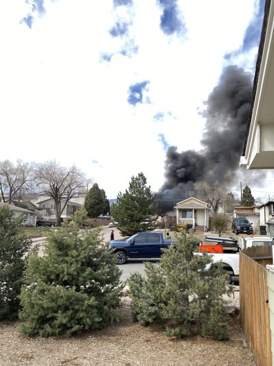 Black smoke coming from a house fire