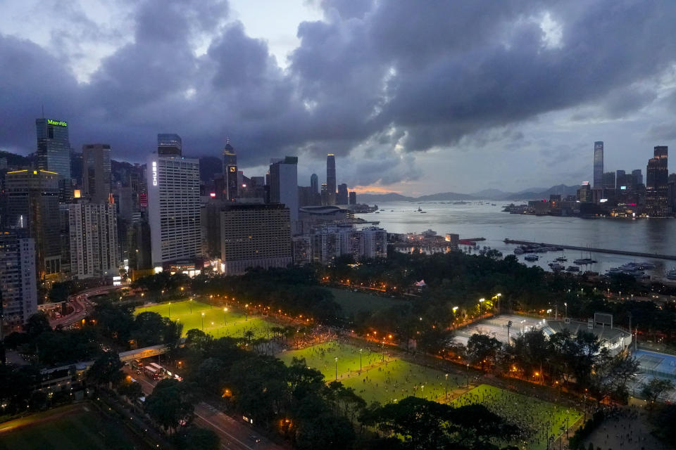 In this aerial view, participants start to gather for a vigil for the victims of the 1989 Tiananmen Square Massacre at Victoria Park in Causeway Bay, Hong Kong, Thursday, June 4,2020, despite applications for it being officially denied. China is tightening controls over dissidents while pro-democracy activists in Hong Kong and elsewhere try to mark the 31st anniversary of the crushing of the pro-democracy movement in Beijing's Tiananmen Square. (AP Photo/Vincent Yu)