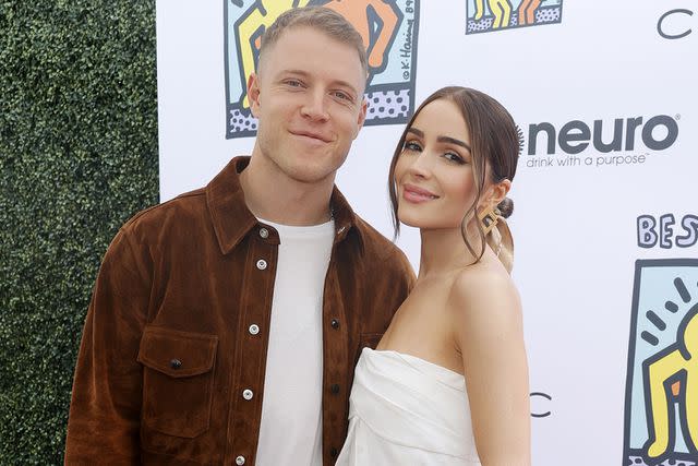 <p>Stefanie Keenan/Getty Images</p> Christian McCaffrey and Olivia Culpo in 2023