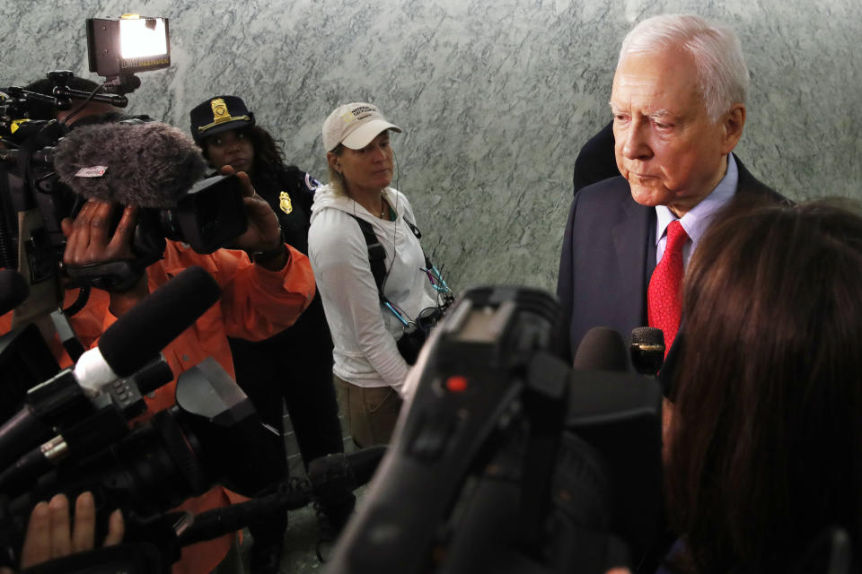 Sen. Orrin Hatch, R-Utah, answers questions from reporters about allegations of sexual misconduct against Supreme Court nominee Brett Kavanaugh, Wednesday, Sept. 26, 2018, as he arrives for a Senate Finance Committee hearing on Capitol Hill in Washington. (AP Photo/Jacquelyn Martin)