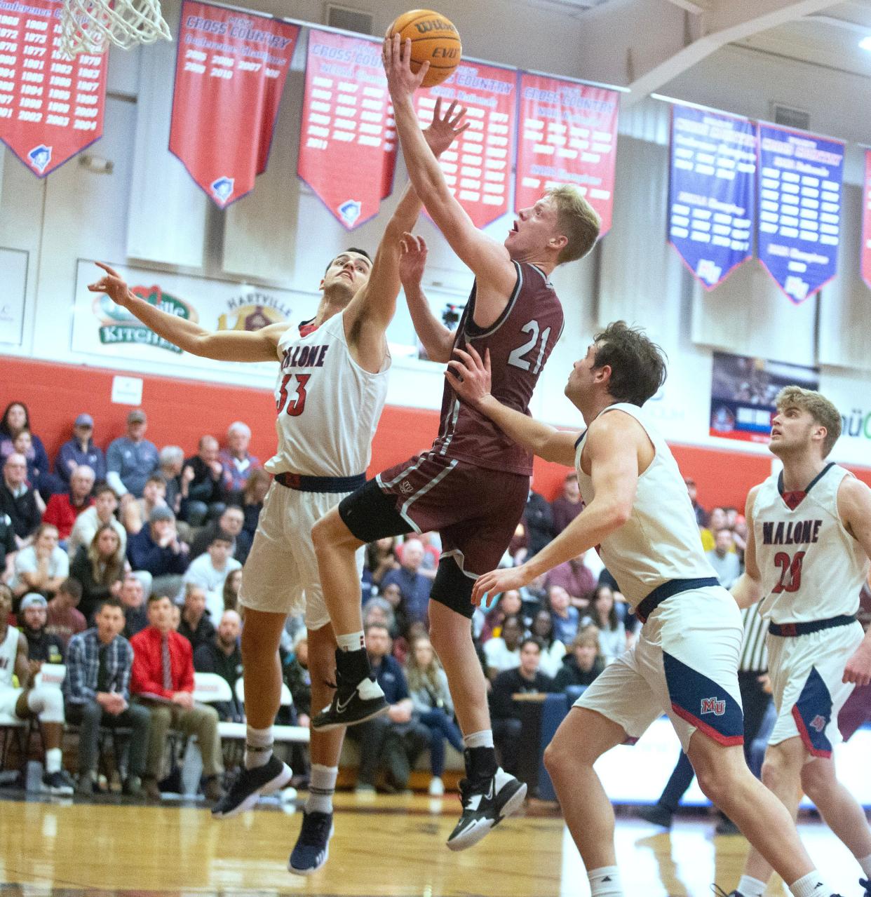 Walsh's Garrison Keeslar puts up a layup during last year's Mayors' Cup game against Malone.