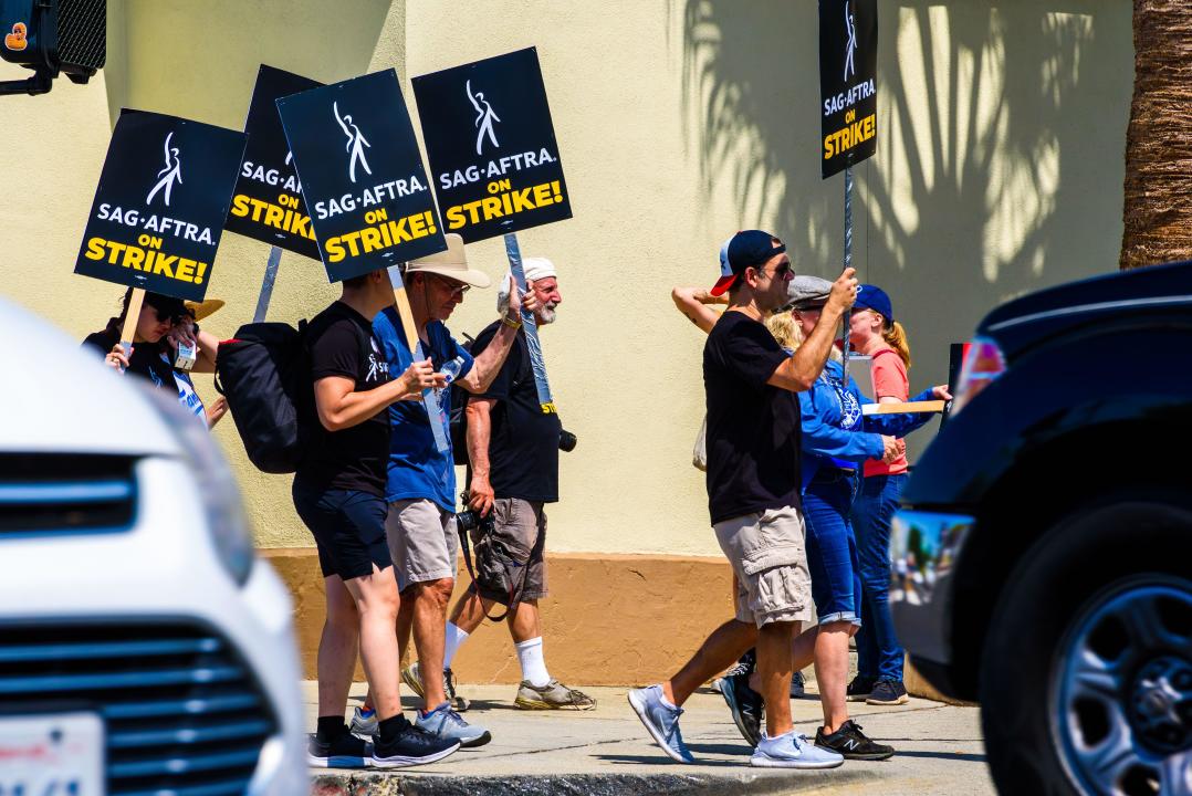 A wide closeup of the picket line during the writers and actors strike in front of Paramount Studios in Burbank, California on July 17, 2023.