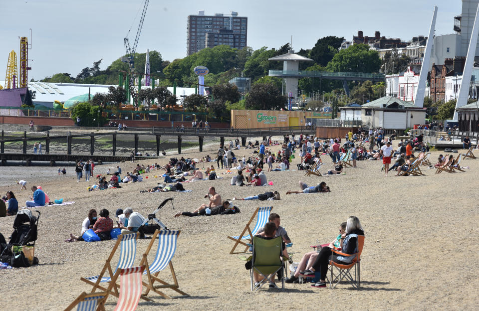 SOUTHEND ON SEA, ENGLAND - MAY 17: People flock to the beach to enjoy the sunshine and warm weather during the coronavirus, covid-19 pandemic on May 17, 2020 in Southend on Sea, England . The prime minister announced the general contours of a phased exit from the current lockdown, adopted nearly two months ago in an effort curb the spread of Covid-19. (Photo by John Keeble/Getty Images)