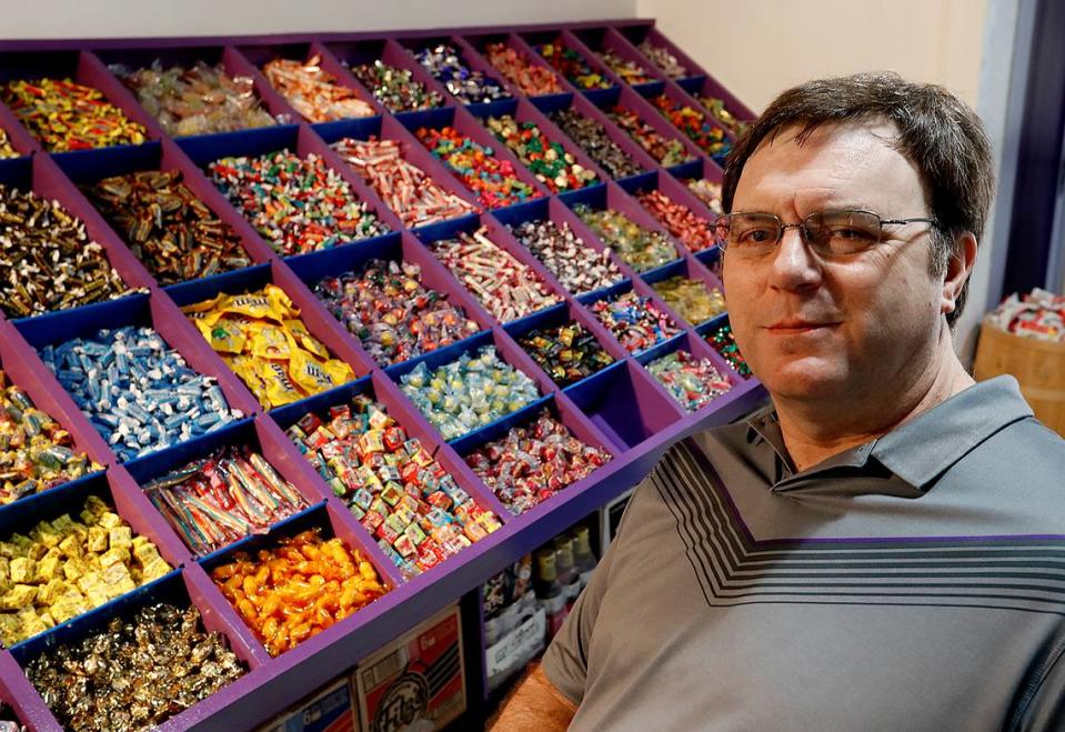 This BND file photo shows Crafty Sugar Co. co-owner Mike Thouvenot with some of the bulk candy at his shop in Belleville.