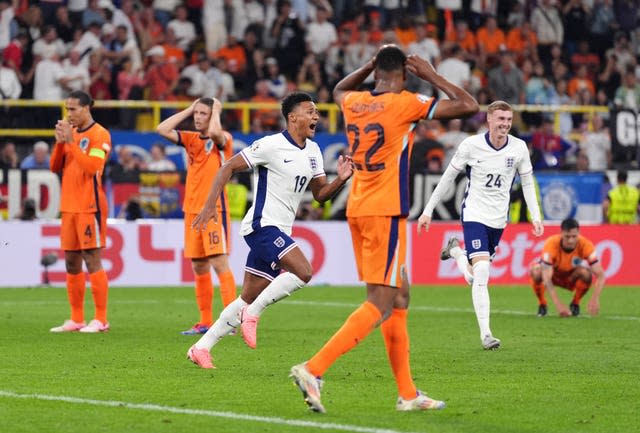 Ollie Watkins, centre, and Cole Palmer, right, celebrate England's winner against the Netherlands as defenders Virgil van Dijk, Joey Veerman and Denzel Dumfries look dejected