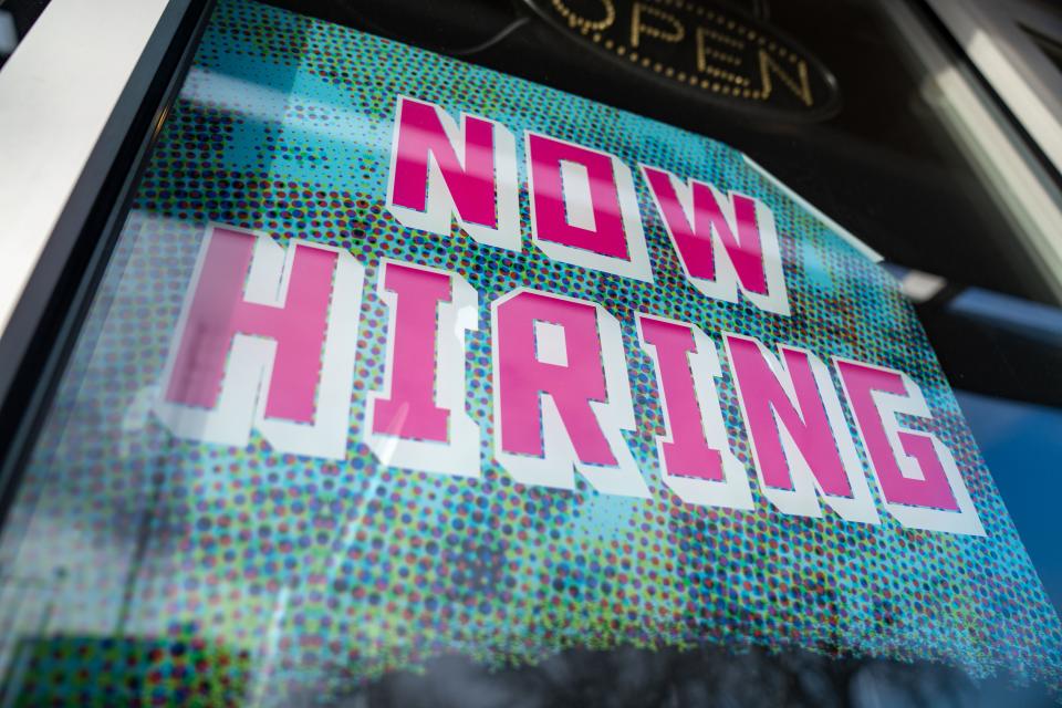 A not hiring sign posted at Qdoba in Des Moines, Friday, Feb. 3, 2023.