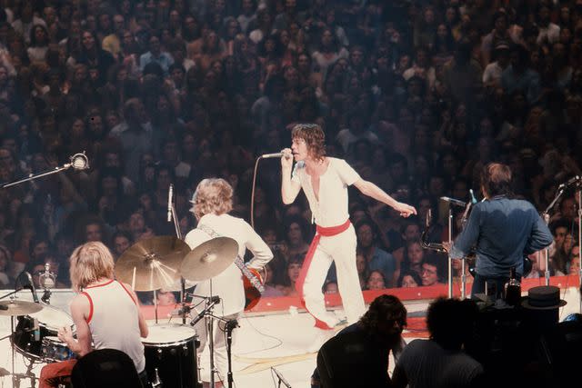 <p>Robert R. McElroy/Getty</p> Mick Jagger performs in New York in July 1972.