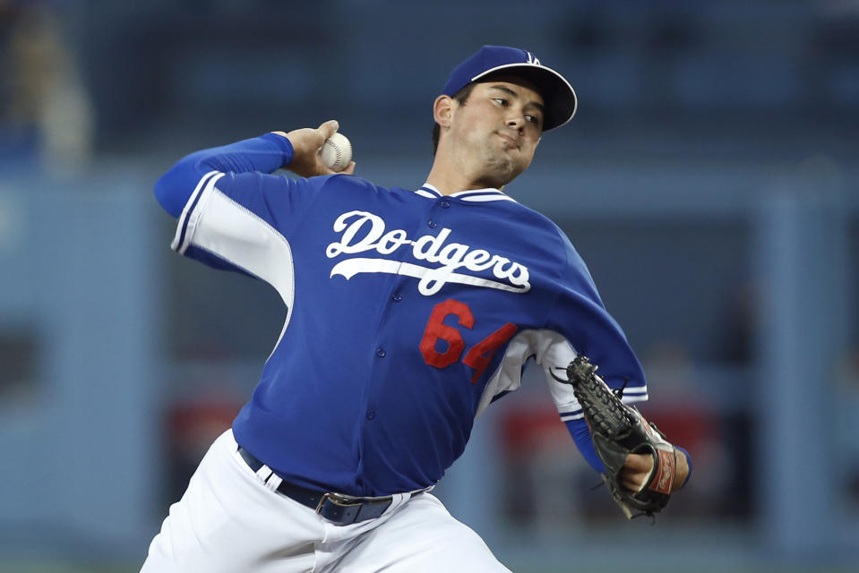 Los Angeles Dodgers starting pitcher Zach Lee delivers against the Los Angeles Angels during the first inning of an exhibition baseball game in Los Angeles, Friday, March 28, 2014. (AP Photo/Danny Moloshok)