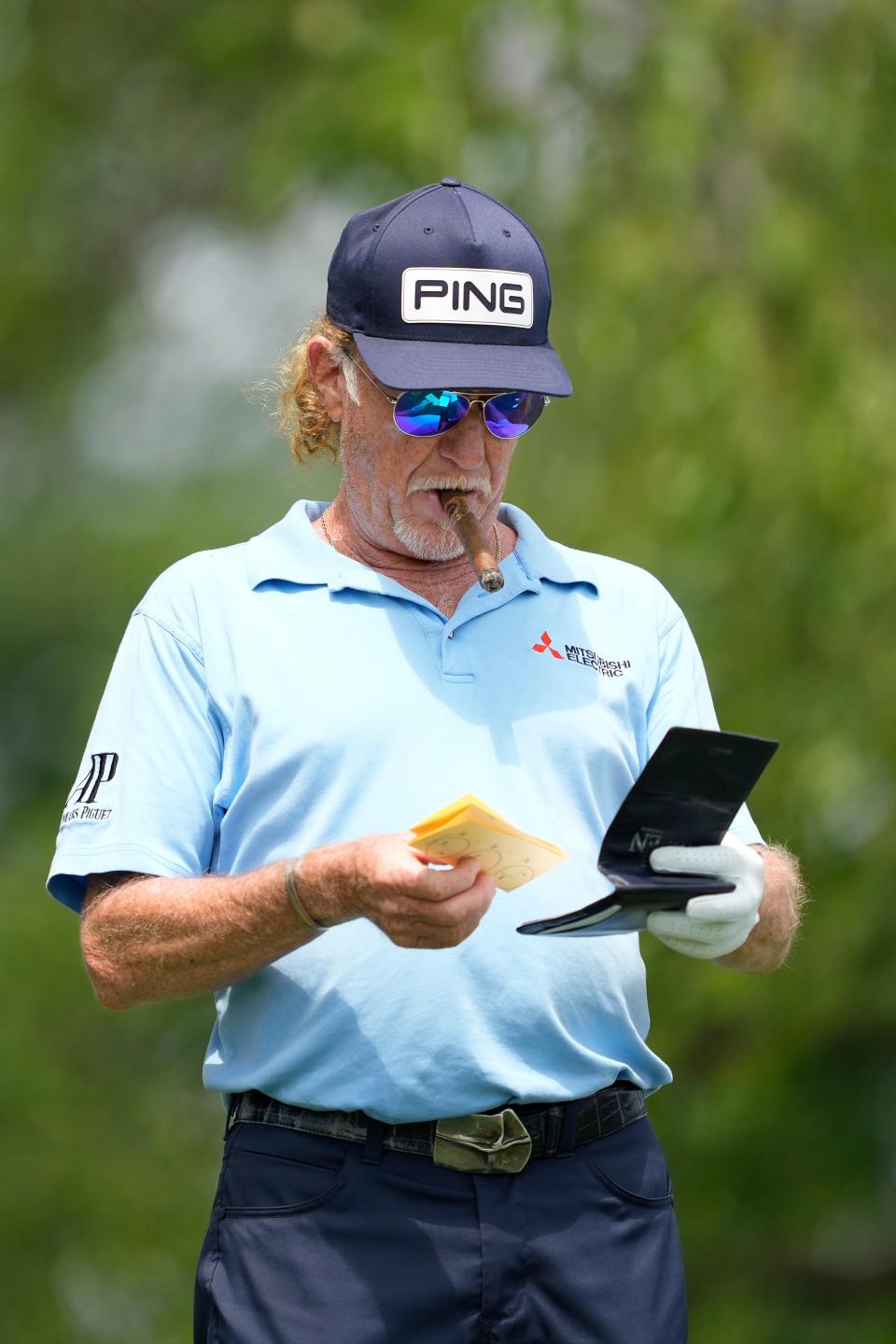Miguel Angel Jimenez checks his yardage book on the tee box on the second hole Saturday in Madison.