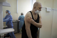 FILE - In this Feb. 15, 2021, file photo, an elderly man leaves a room after getting a shot of Russia's Sputnik V coronavirus vaccine in the clinic in Petrozavodsk, Karelia region, Russia. Russia’s boast in August that it was the first country to authorize a coronavirus vaccine led to skepticism because of its insufficient testing on only a few dozen people. Now, with demand growing for the Sputnik V, experts are raising questions again, this time over whether Moscow can keep up with all the orders from countries that want it. (AP Photo/Dmitri Lovetsky, File)