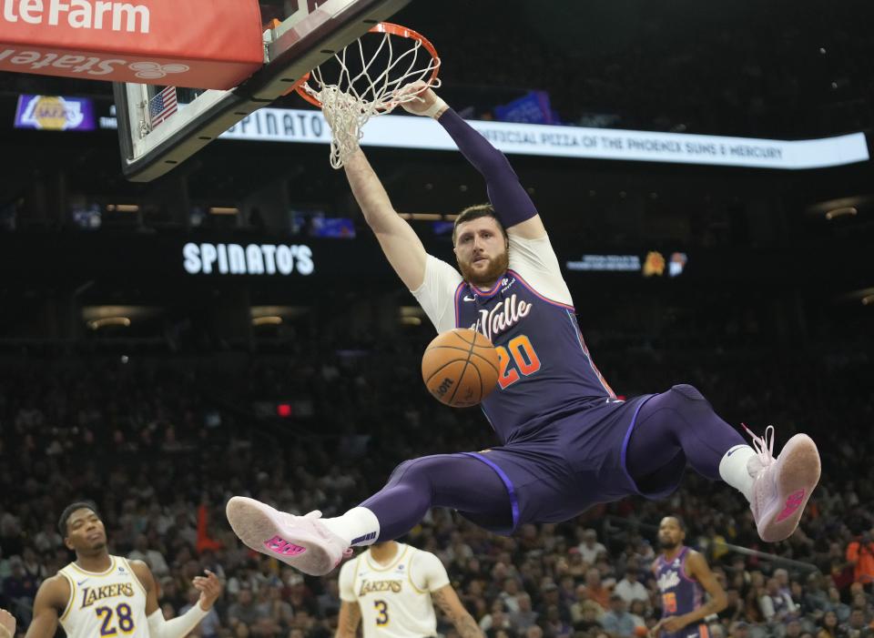 Phoenix Suns center Jusuf Nurkic (20) slams two against the Los Angeles Lakers during the second quarter at Footprint Center on Feb. 25, 2024.