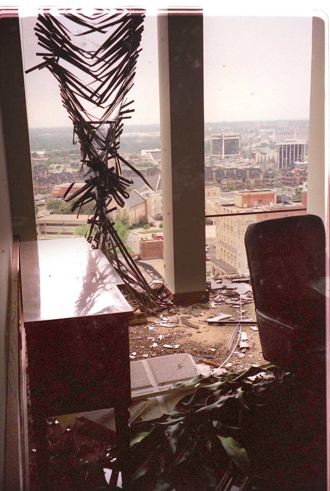 An office of the McDonald, Clay, Crow,& McGartland Law firm on the 14th floor of the Bank One tower shows the broken out glass and blinds of the windows to the office. Out the window you can see the Cash America Building and the Mallick Tower. which were also damaged in the March 28, 2000 tornado.