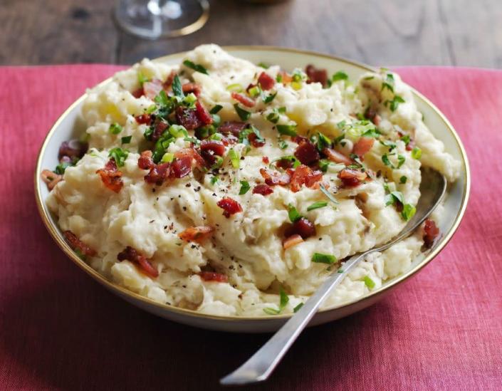 <p>If you're looking for a side dish that's a bit more decadent, then add some sour cream and bacon crumbs to your mashed potatoes. </p><p><strong><em><a href="https://www.womansday.com/food-recipes/food-drinks/recipes/a52077/sour-cream-smashed-potatoes-with-bacon-crumbs/" rel="nofollow noopener" target="_blank" data-ylk="slk:Get the Sour Cream Smashed Potatoes with Bacon Crumbs recipe" class="link rapid-noclick-resp">Get the Sour Cream Smashed Potatoes with Bacon Crumbs recipe</a>. </em></strong></p>