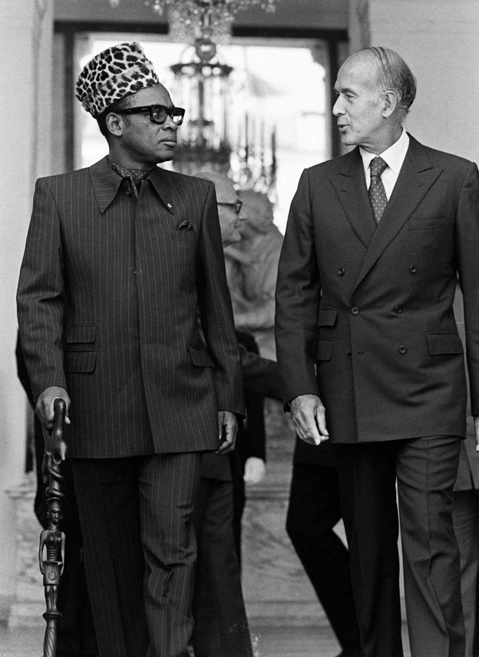 In this Sept.6, 1979 file photo, Zaire's President Mobutu Sese Seko, left, walks with French President Valery Giscard d'Estaing after a meeting at the Elysee Palace in Paris. Valery Giscard d’Estaing, the president of France from 1974 to 1981 who became a champion of European integration, has died Wednesday, Dec. 2, 2020 at the age of 94, his office and the French presidency said. (AP Photo, File)