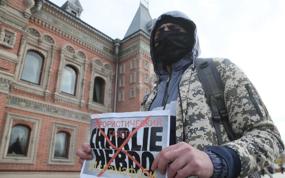 Russian Muslims rallied outside the French Embassy in Moscow earlier this week to protest against President Emmanuel Macron's stance on cartoons mocking Prophet Muhammed - Vladimir Gerdo/Tass via Getty Images