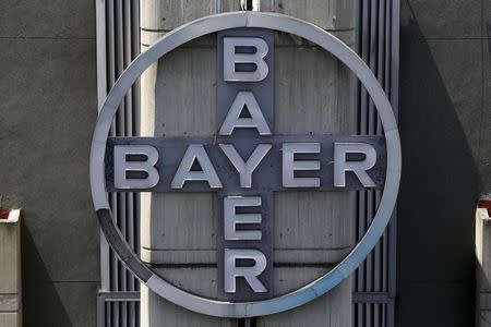 The corporate logo of Bayer is seen at the headquarters building in Caracas May 6, 2015. REUTERS/Carlos Garcia Rawlins