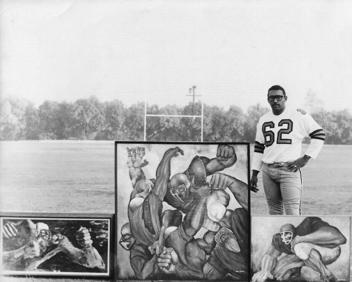 Ernie Barnes with paintings on movie set “Number One” starring Charlton Heston in 1969.