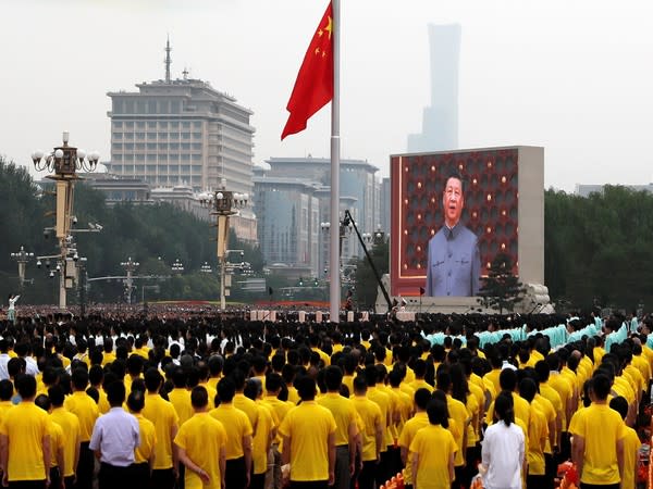  A giant screen shows Chinese President Xi Jinping in Beijing.