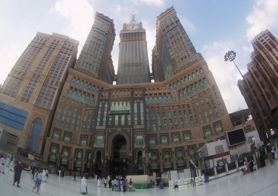 Muslims visit and walk in front of the Mecca Clock Tower after they finished their Umrah Mawlid al-Nabawi pilgrimage, at the Grand Mosque in the holy city of Mecca