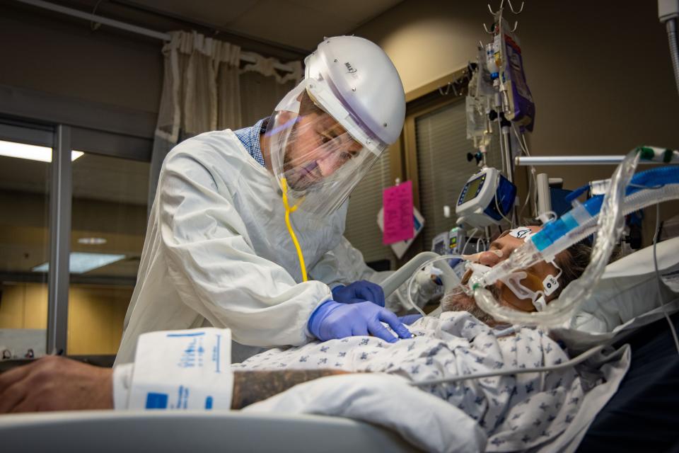 ICU director Dr. Tamim Mahayni listens to patient Rodney Eurom's chest at Mary Greeley Medical Center in Ames.