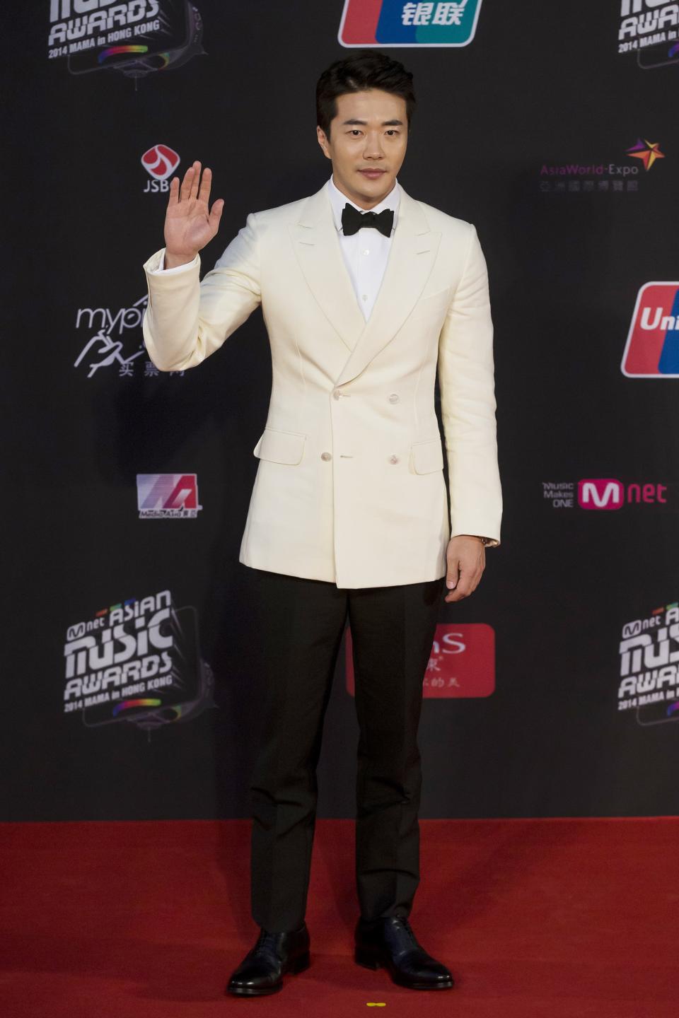 South Korean actor Kwon Sang-woo poses on the red carpet as he attends the 2014 Mnet Asian Music Awards (MAMA) in Hong Kong