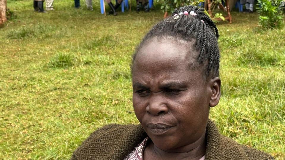 Rebecca's mother Agnes Cheptegei sits outside 