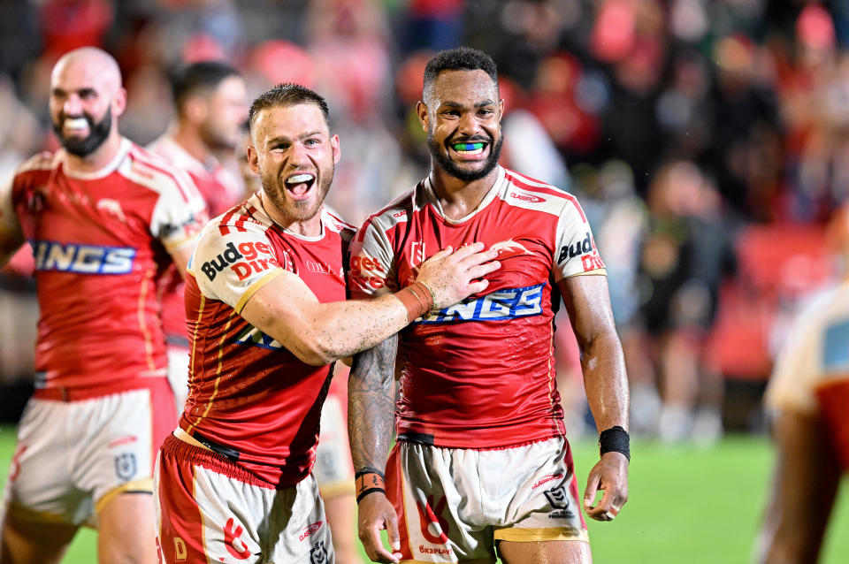 Hamiso Tabuai-Fidow and Euan Aitken celebrate a Dolphins win.