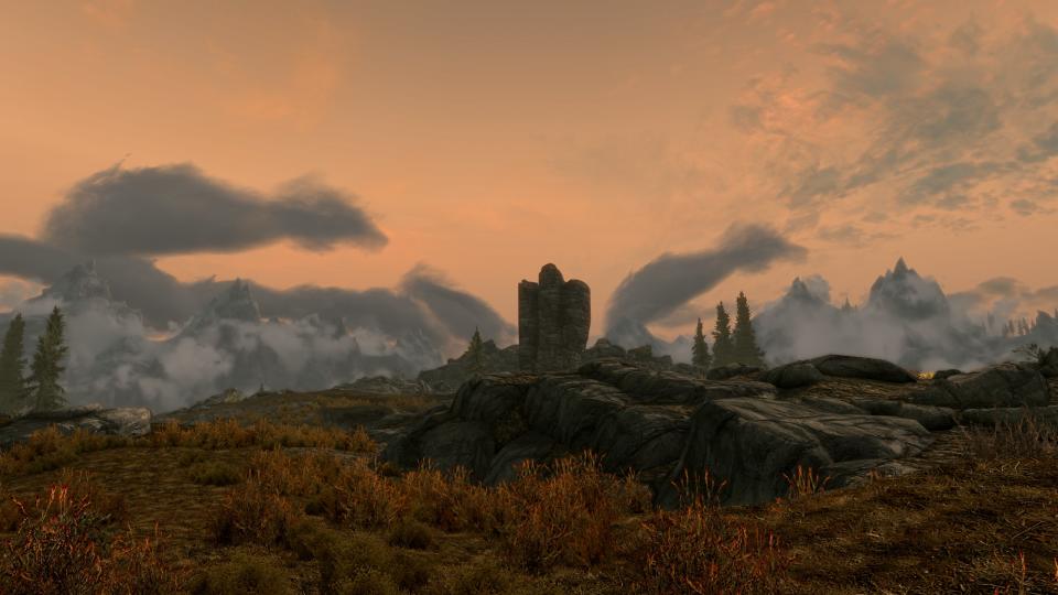 Best Skyrim mods - an evening screenshot of a ruined tower outside Whiterun, with added moodiness from the improved clouds provided by the Real Clouds mod