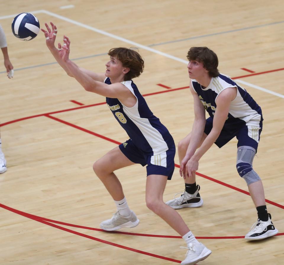 Salesianum's Cody Popp plays the ball in front of Christian Sullivan in the first game of Cape Henlopen's 3-0 win for the first DIAA state title earned in boys volleyball, Tuesday, May 23, 2023 at Smyrna High School.