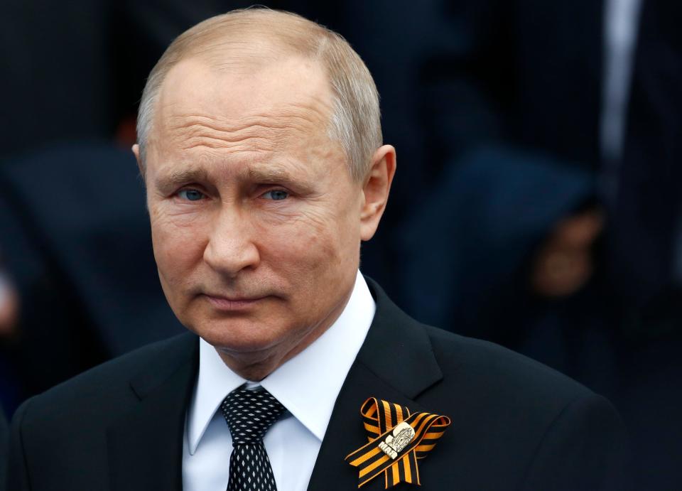 FILE - In this file photo taken on Thursday, May 9, 2019, Russian President Vladimir Putin walks to attend a military parade marking 74 years since the victory in WWII in Red Square in Moscow, Russia. Spring is not turning out the way Russian President Vladimir Putin might have planned it. A nationwide vote on April 22 was supposed to finalize sweeping constitutional reforms that would allow him to stay in power until 2036, if he wished. But after the coronavirus spread in Russia, that plebiscite had to be postponed an action so abrupt that billboards promoting it already had been erected in Moscow and other big cities. (AP Photo/Alexander Zemlianichenko, File)