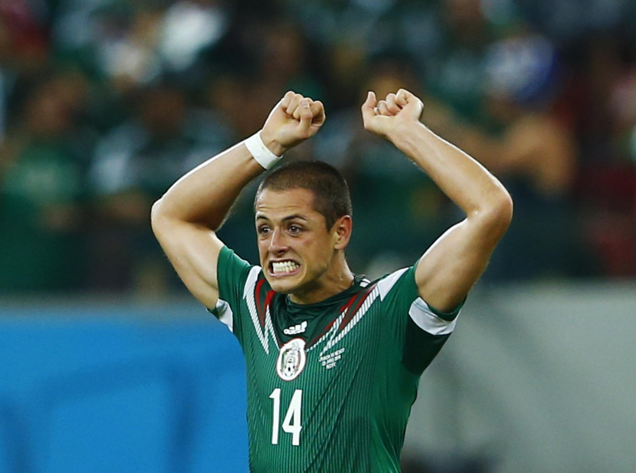 Mexico's Javier Hernandez celebrates after scoring a goal during their 2014 World Cup Group A soccer match against Croatia at the Pernambuco Arena in Recife June 23, 2014. REUTERS/Eddie Keogh (BRAZIL  - Tags: SOCCER SPORT WORLD CUP TPX IMAGES OF THE DAY)  