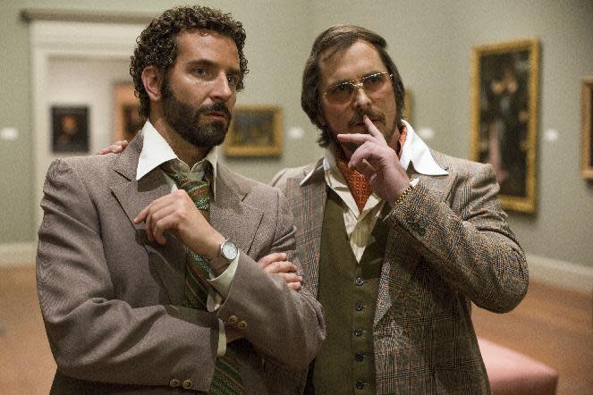 This film image released by Sony Pictures shows Bradley Cooper, left, and Christian Bale in a scene from "American Hustle." (AP Photo/Sony - Columbia Pictures, Francois Duhamel)