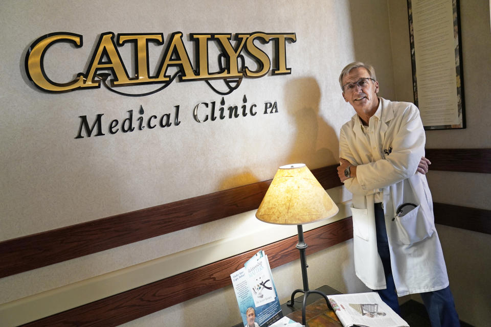 Dr. Scott Jensen, shown at his Watertown, Minn., clinic on Sept. 22, 2021, is a family physician now running for governor. He's become the frontrunner for the GOP nomination on a platform of vaccine skepticism and opposition to the restrictions that Democratic Gov. Tim Walz and President Joe Biden have used to manage the pandemic. AP Photo/Jim Mone)