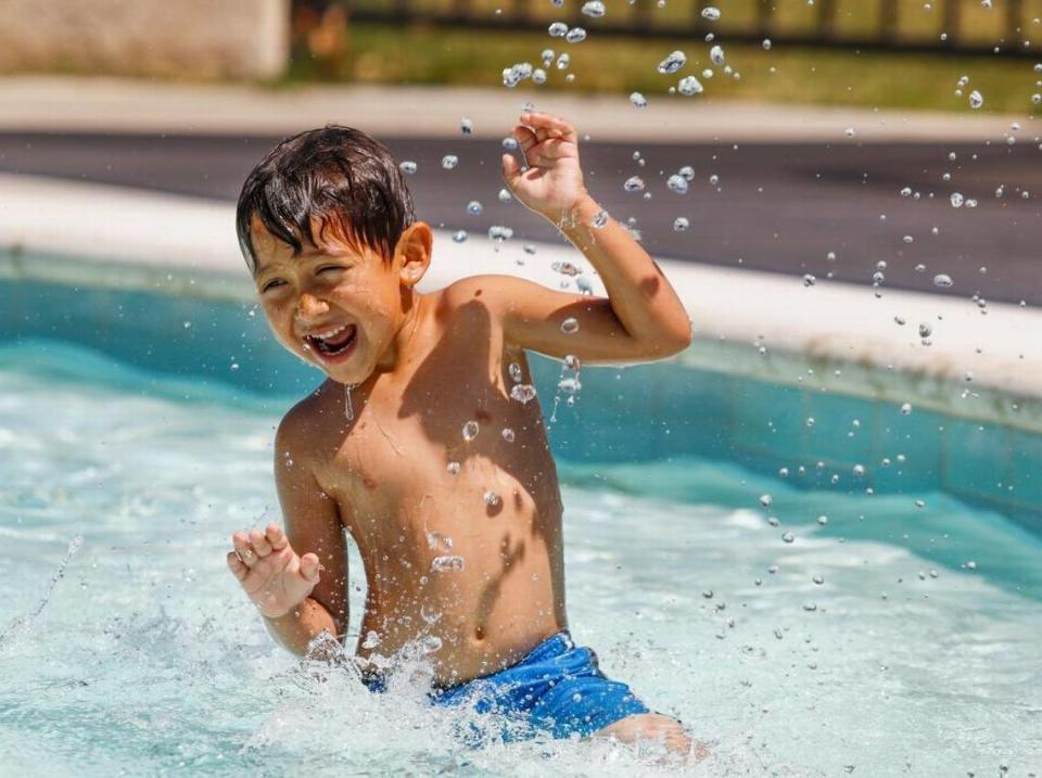 Ace Ortiz, 5, of Paso Robles enjoys the fountain feature at Centennial Park Pool in Paso Robles.