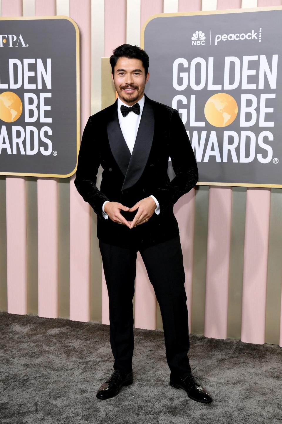 Henry Golding attends the 2023 Golden Globes.