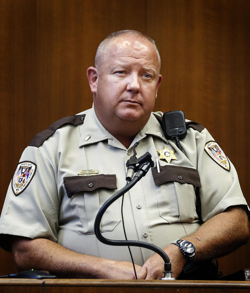 CORRECTS TITLE TO SHERIFF’S DEPUTY NOT SHERIFF - Panola County Sheriff’s Deputy Chuck Tucker testifies on the second day of the retrial of Quinton Tellis in Batesville, Miss., on Wednesday, Sept. 26, 2018. Tellis is charged with burning 19-year-old Jessica Chambers to death almost three years ago on Dec. 6, 2014. He has pleaded not guilty to the murder. (Mark Weber/The Commercial Appeal via AP, Pool)