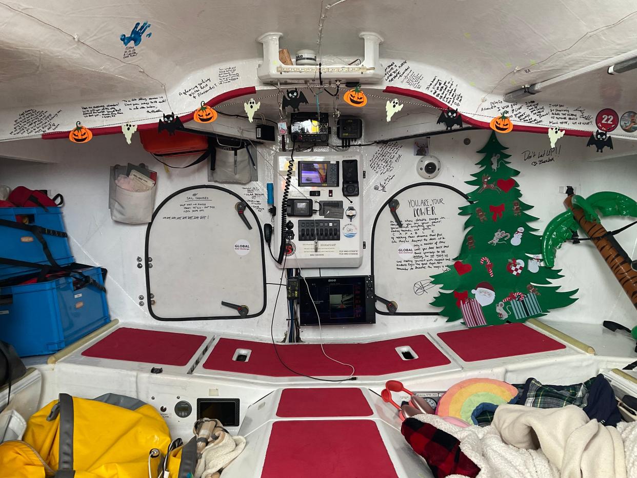Cole Brauer sailed solo around the world in a sailboat named First Light, which she decorated for Halloween and Christmas. When it was time to sleep, Brauer nestled herself in bedding on the floor of the boat to stay warm.