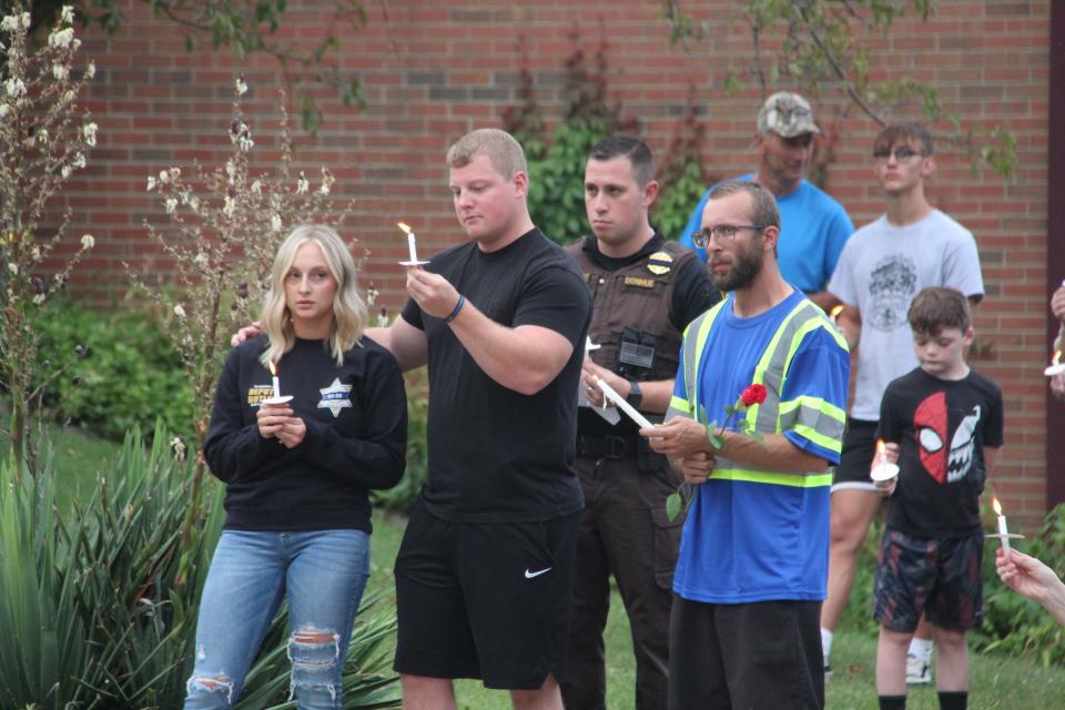 Hillsdale County Sheriff's Sgt. Casey Donihue attended the candlelit vigil outside of the sheriff's office July 4.