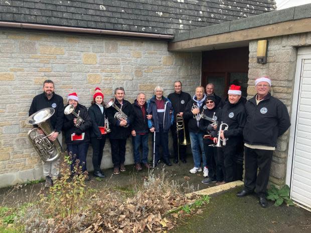 Falmouth Packet: Helston band members with Edward Ashton in December 2022 