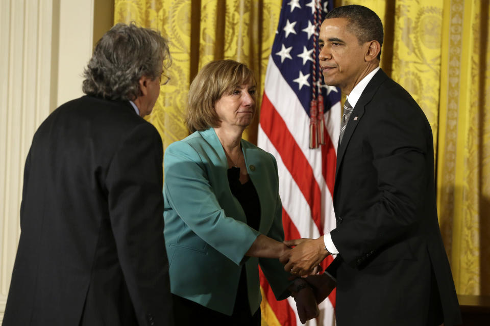 President Barack Obama greets the parents of Sandy Hook Elementary School teacher Lauren Rousseau, Friday, Feb. 15, 2013, in the East Room of the White House in Washington, before presenting them with a 2012 Citizens Medal. (AP Photo/Jacquelyn Martin)