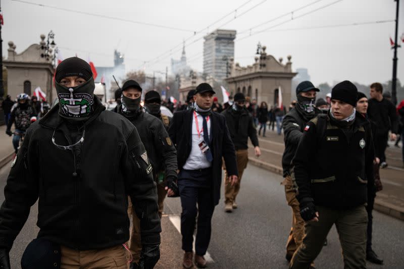 Participants and Robert Bakiewicz, head of the association of Polish far-right groups that organized the "Independence March", march to mark the National Independence Day in Warsaw, Poland