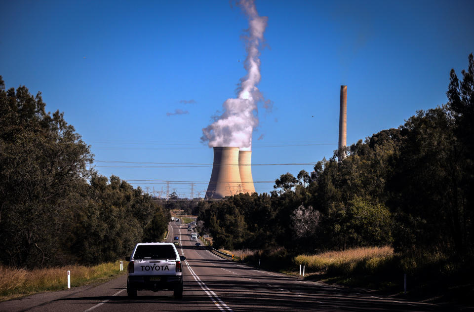 Smoke and steam rises from the Bayswater coal-powered thermal power station located near Muswellbrook, New South Wales, in Australia. Photo: David Gray/Getty Images